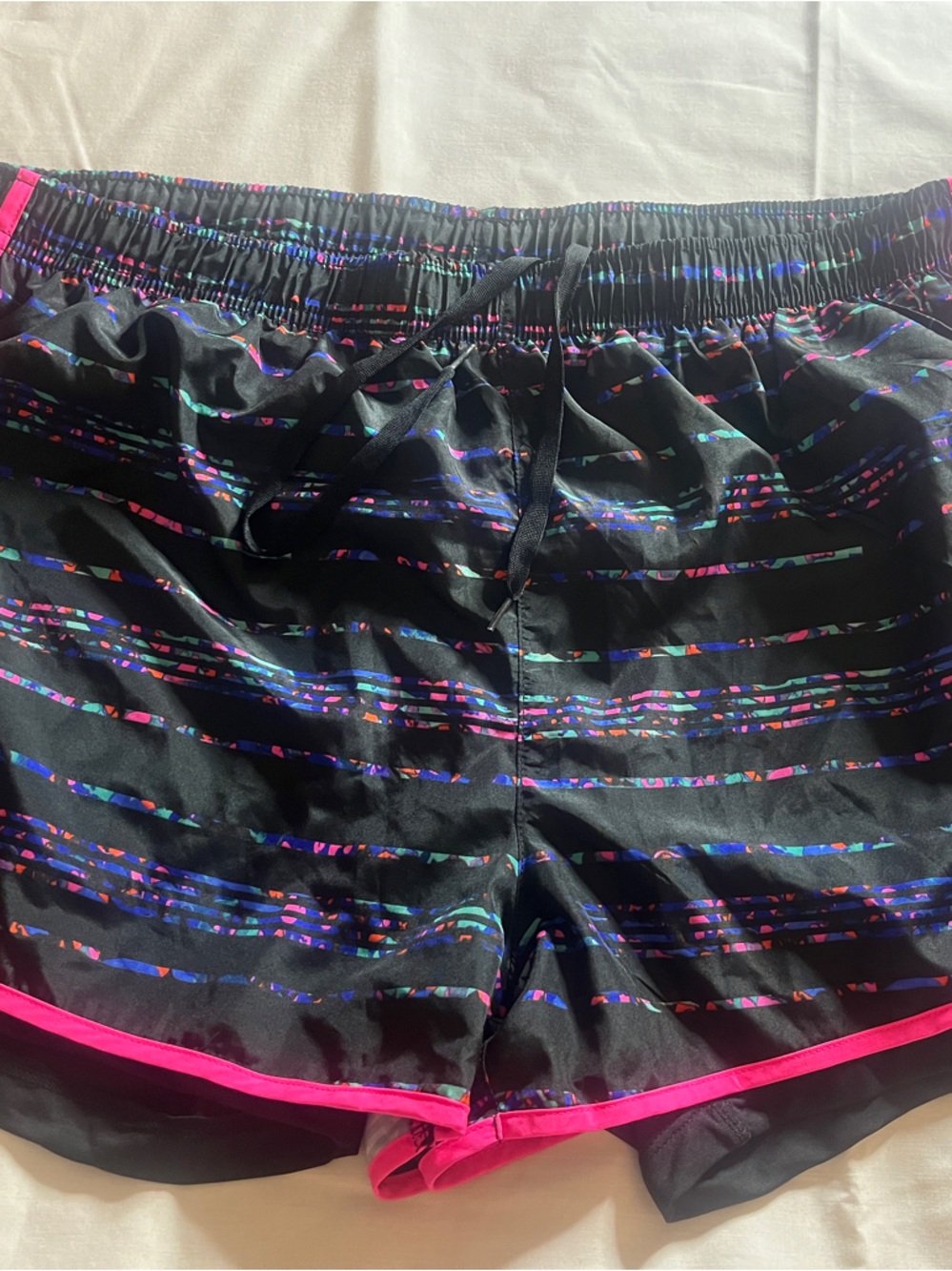 Reebok Black Athletic Shorts with Neon Pink Trim and Iridescent Stripe Pattern